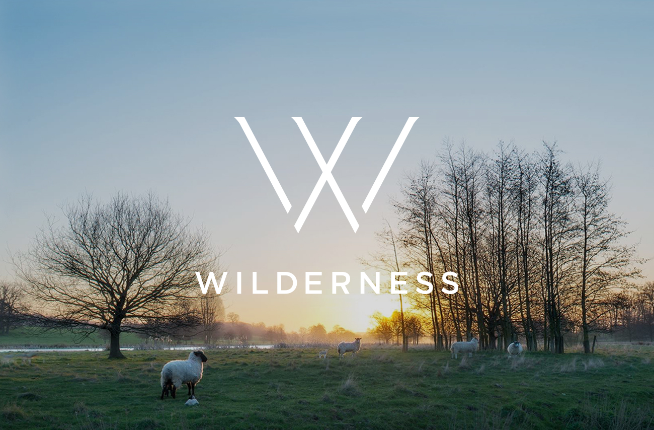 Wilderness logo on photography of Suffolk landscape