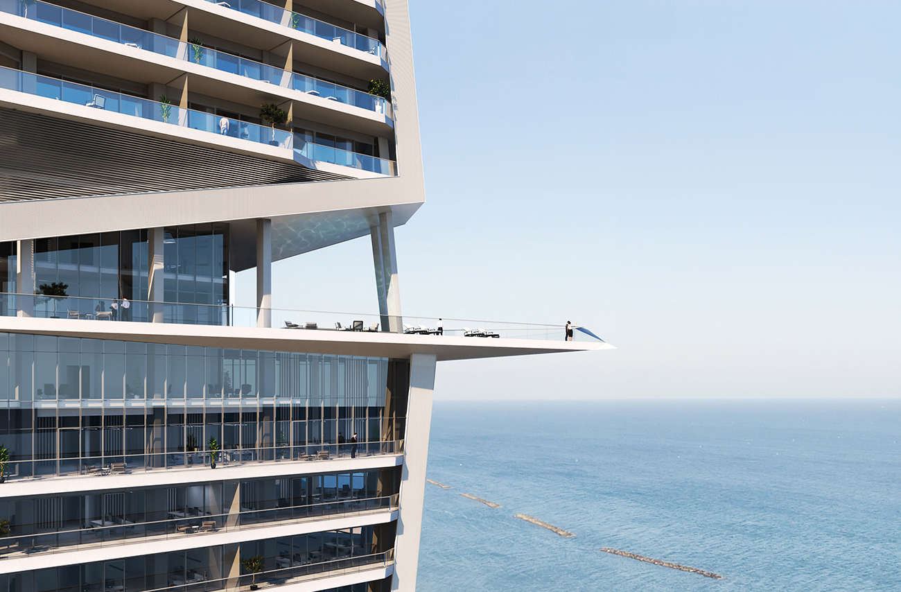 Balcony of large apartment complex overlooking blue sea