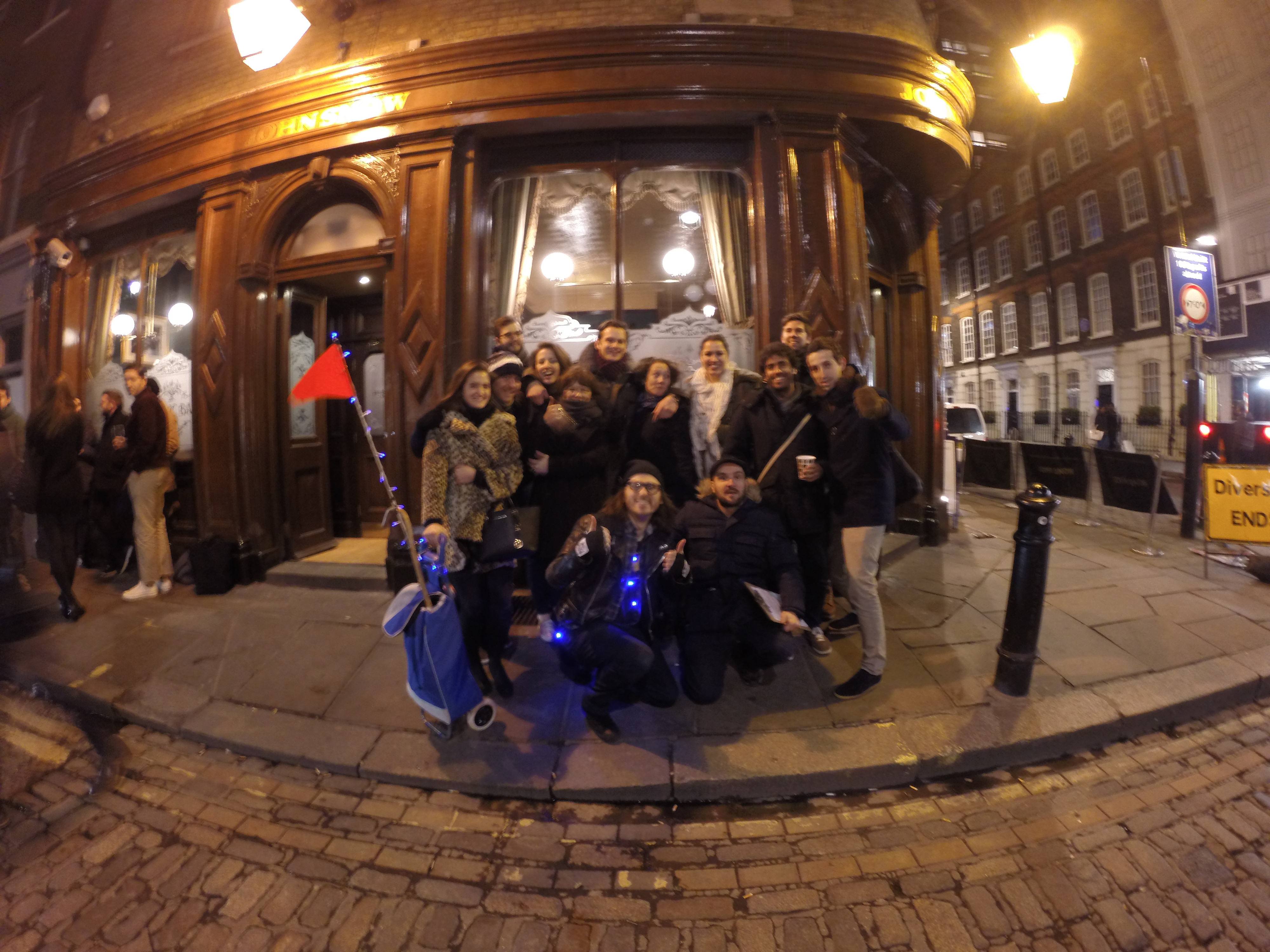 group of colleagues outside pub at night