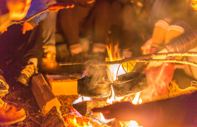 Food being cooked over an open campfire