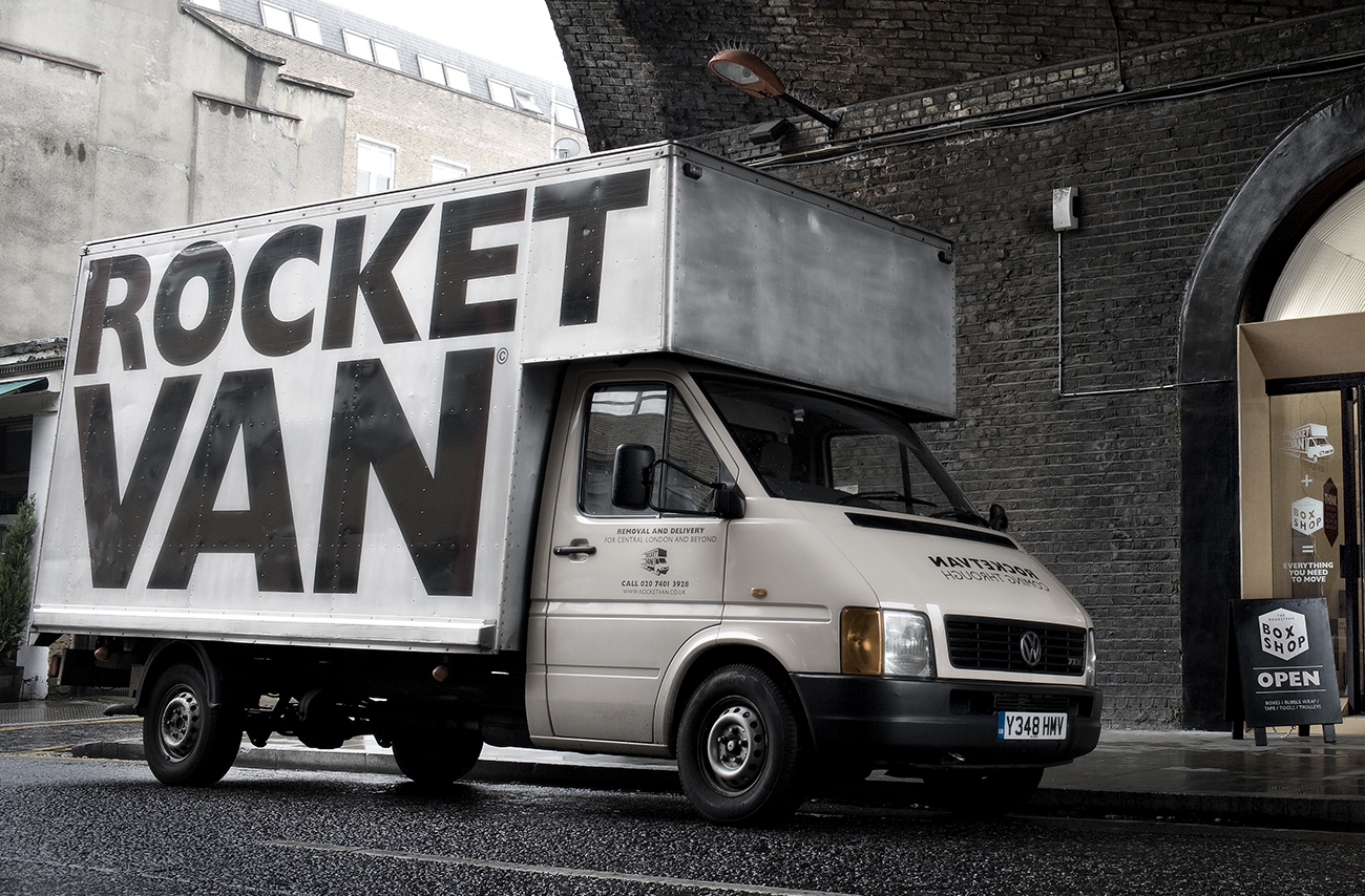 RocketVan branded van parked under bridge in moody light